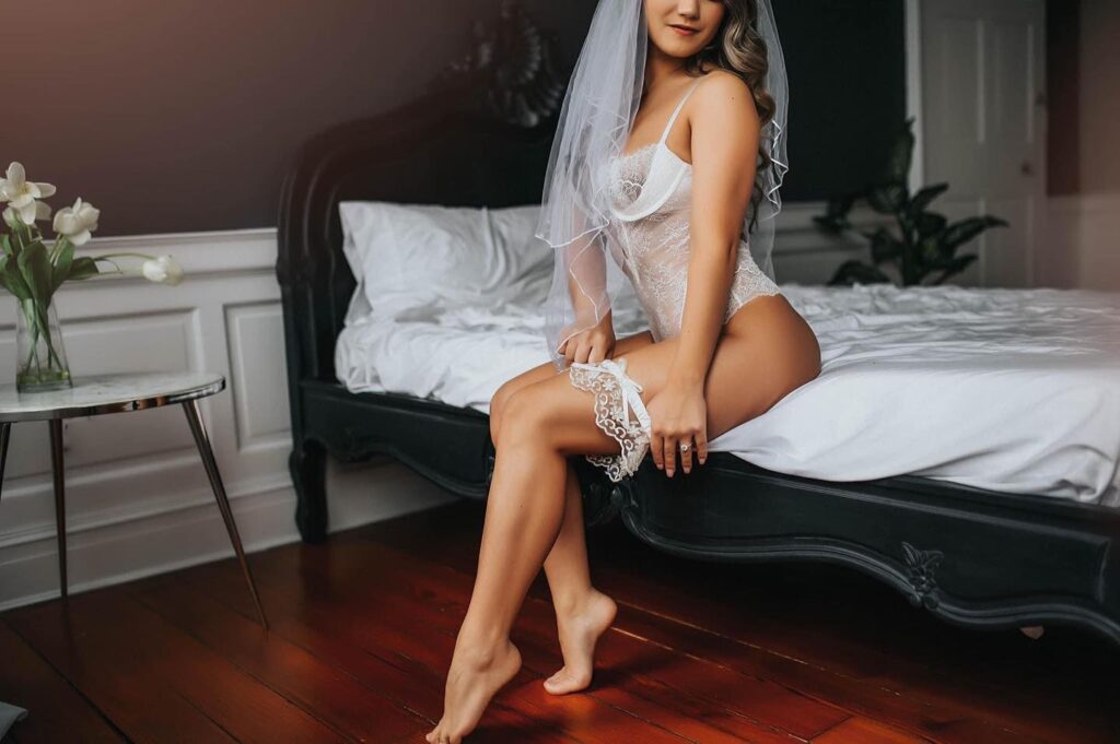 Bridal boudoir photoshoot as a gift for groom featuring Black Lace Boudoir client.