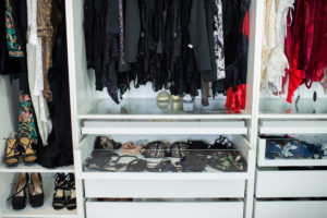Boudoir photography client closet at Black Lace Boudoir featuring lingerie and shoes.