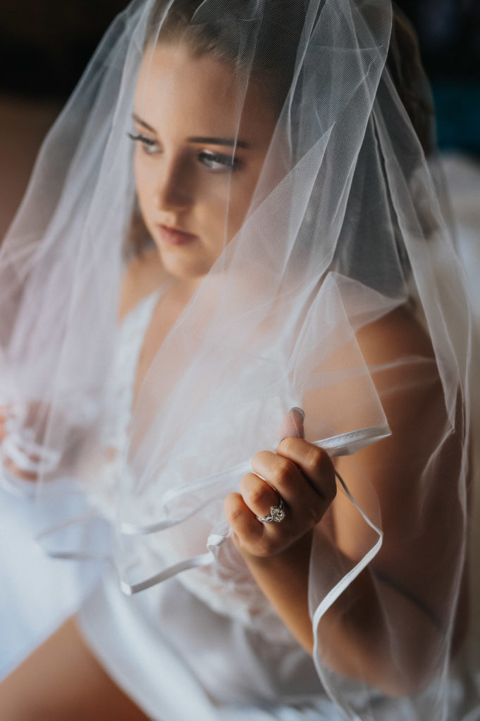 Bridal Boudoir with veil and engagement ring