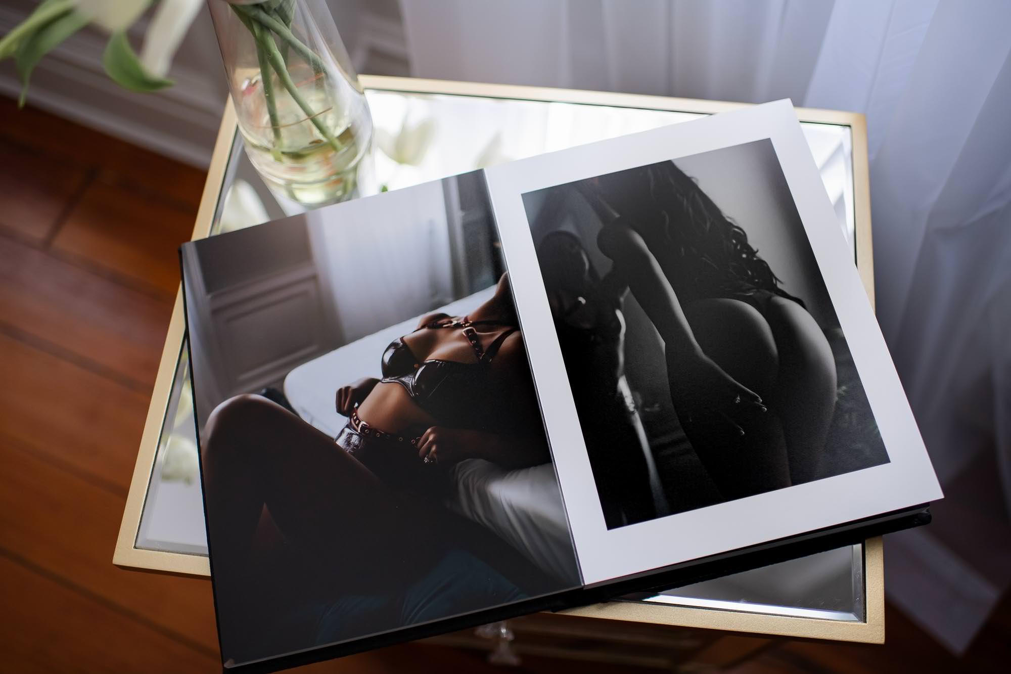 Professional boudoir products, canvas and photos sitting on side table.