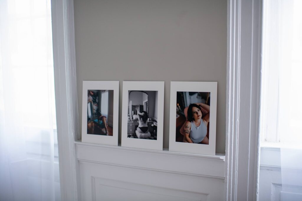 Framed images on a wall demonstrating a boudoir Valentine's gift idea.
