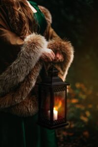 fantasy medieval photoshoot in Ireland with lantern in the forest